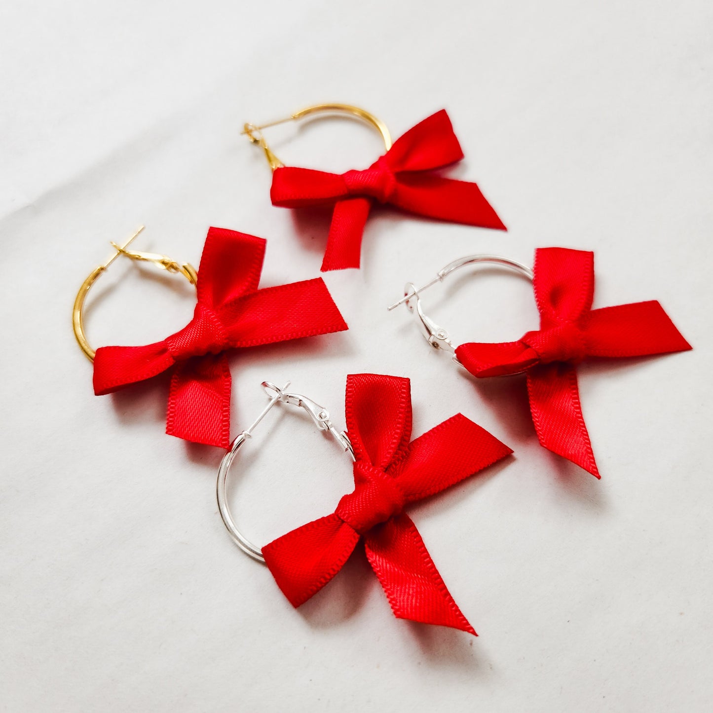 Mini Bow Hoop Earrings available with gold or silver details