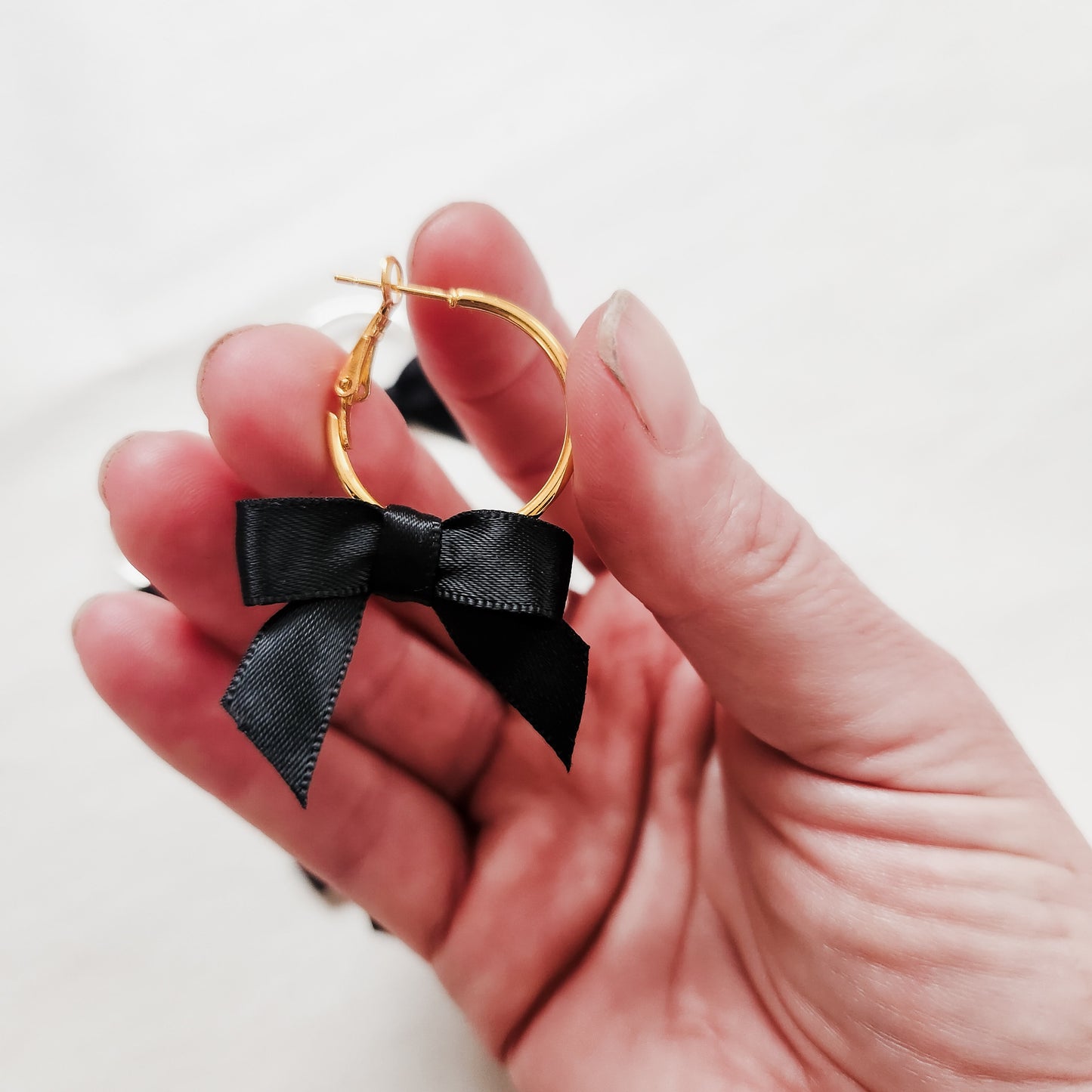 Mini Bow Hoop Earrings available with gold or silver details