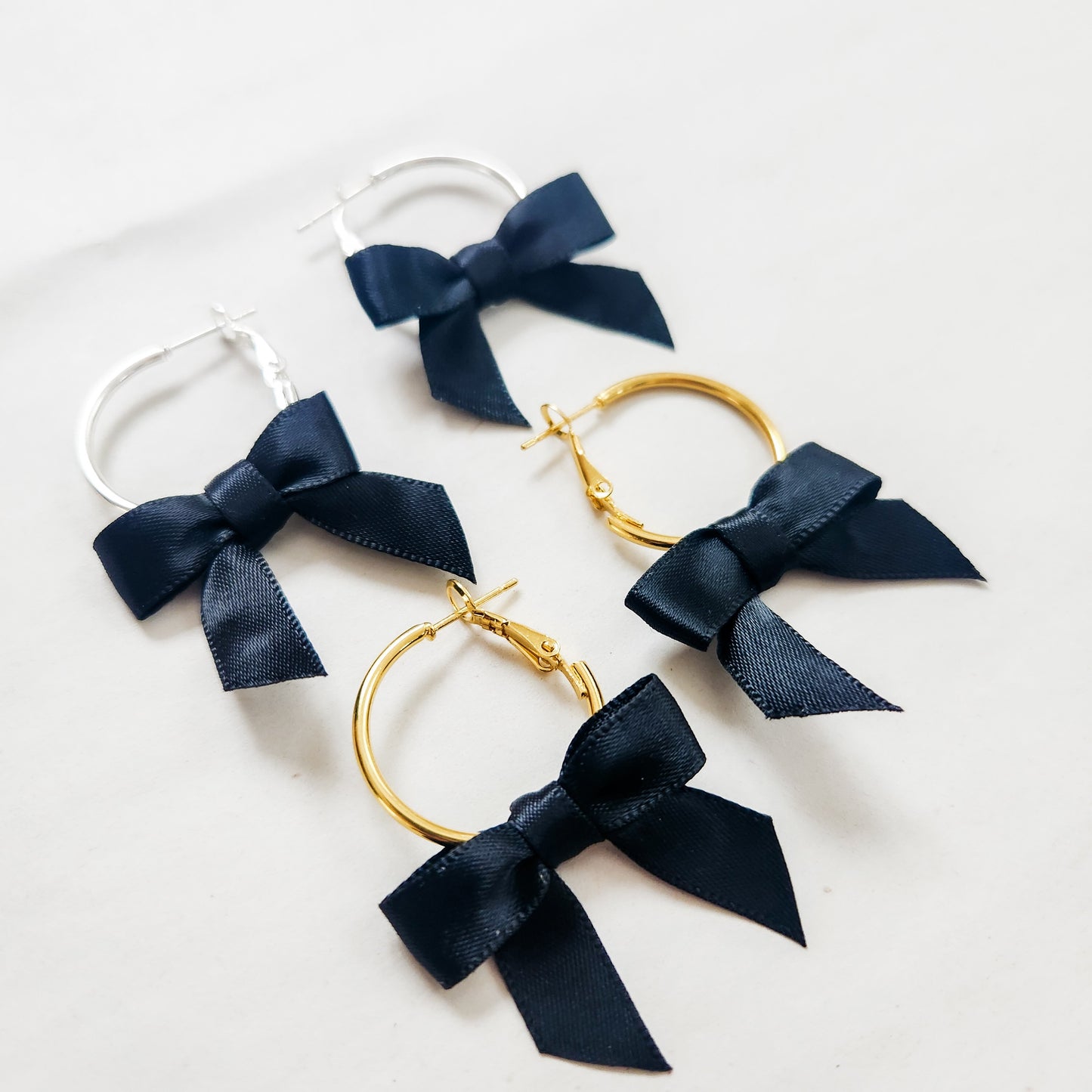 Mini Bow Hoop Earrings available with gold or silver details